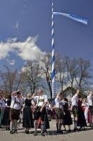 The European people entertain the townsfolk with their dance at the Maibaumfest in Putzbrunn, Germany.