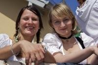 These girls enjoy the traditional German European Maibaumfest celebrations in the small village of Putzbrunn, near Munich, Germany.