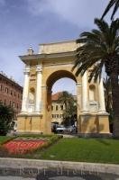 The impressive Finale Ligure Arch in the Piazza Vittorio Emanuele II along the waterfront in the town of Finale Ligure, Liguria in Italy, Europe.