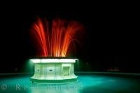 At night, an illuminated fountain adorns the seaward side of the Marine Parade in Hawkes Bay on the North Island of NZ.