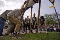 The Maibaum is raised by a large team of men during the traditional Maibaum Festival in Putzbrunn, Bavaria, Germany.