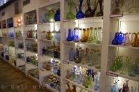 Shelves of glass products line the factory at La Verrerie de Biot in the village of Biot in the Provence, France in Europe.
