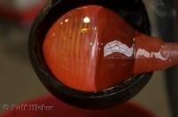 An interesting art form is glass blowing where the technique uses molten glass.