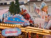 An elaborately decorated gluehwein stall stands out to attract punters at the Christmas Markets in the historic old town centre of Regensburg, Bavaria, Germany.