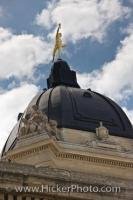 The top of the dome of the Manitoba Legislative Building in the City of Winnipeg is adorned with the Golden Boy statue.