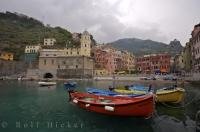 A view of the harbour of the village of Vernazza in Liguria, Italy as rain threatening clouds hang atop the hillsides.