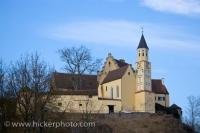 Atop the hillside, stands the uniquely designed Hexenagger Castle overlooking the town of Hexenagger in Bavaria, Germany.