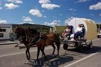 Horse drawn wagons make their way through the town of Roxburgh in Central Otago, New Zealand as a fund raising event for Westpac Helicopter Rescue.