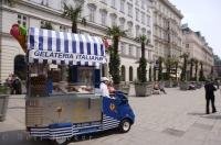 A vendor cruises Graben Square selling Gelati, an Italian ice cream, to people touring Vienna, Austria.