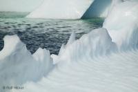 Interesting marks show the erosion of the ocean on an iceberg off the coast of Newfoundland in Canada.