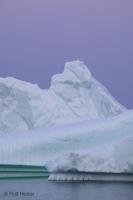 photo of an Iceberg after sunset in the magic blue hour