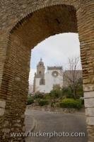 The Iglesia de la Santa Maria la Coronada, a church in the town of Medina Sidonia in the Province of Cadiz in Andalusia, Spain, can be seen in the background beyond the stone archway, and is just a short walk past this point.