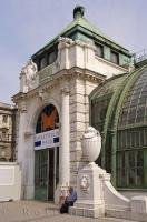 Under the statues and unique architecture of this building you will find the entrance to the Imperial Butterfly House in Vienna, Austria.