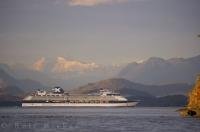 One of the many super sized Alaska cruise ships navigates between Queen Charlotte Strait and Blackfish Sound in BC off the Northern coast of Vancouver Island - part of the Inside Passage route.