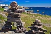 A display of Inukshuks on the shores of Red Bay along the Labrador Coastal Drive in Southern Labrador, Canada.