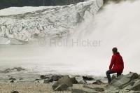 Glacier waterfall with Mendenhall Glacier in background close to juneau alaska