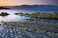 Visiting Kaikoura Peninsula in Canterbury on the South Island of New Zealand at sunset is a breathtaking experience if you like beautiful scenery and wildlife.