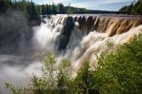 The Kakabeka Falls, also known as the Niagara of the North, is part of the Kaministiquia River and during a spring flood such as in the time this photo was taken it is swollen and much higher than usual.