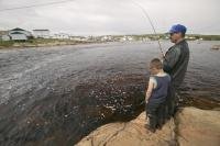 A great way for a father and son to spend time together is to go fishing like this family team in Labrador, Canada.