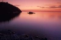 A popular vacation destination, Lake Superior, Ontario is seen here with the beautiful spectrum of colours during the after sunset light.