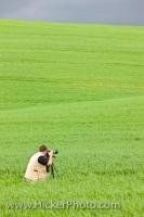 A photographer takes some pictures of the beautiful landscape of the countryside belonging to Tuscany in the Province of Siena in Italy, Europe.