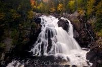 Along the Riviere due Diable in Parc national du Mont Tremblant in Quebec, Canada, the waterfalls are beautiful as they cascade over the landscape while the Autumn forest surrounds them.