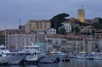 The Old Port and Le Suquet with the Castle on the hill in Cannes on the Cote d Azur, Provence in France, Europe.
