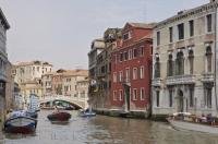 One of the many little or side canals which form a network of waterways through the city of Venice, Italy.