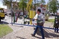 Business signs are attached to the Maibaum after it is raised into position in Putzbrunn, Germany.
