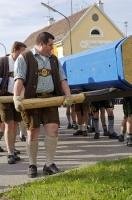 The men of Putzbrunn wheel the May Tree to the town centre for the Maibaumfest in Southern Bavaria, Germany.