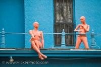 Mannequins sit on the roof of a Victorian styled house near the Kensington Market in Toronto, Ontario in Canada.