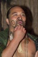 A Maori Warrior displaying his Tattoo in the Tamaki Maori Village on the North Island of New Zealand