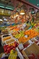 A food market stall at the Central Markets in the City of Florence in Tuscany, Italy displaying a wide selection of fruits and vegetables.