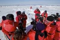 Paul and Heather McCartney draw a crowd of media during a visit onto the pack ice off the coast of Prince Edward Island in Canada.