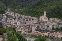 The small medieval village of Luceram in the Provence, France is situated in the center of a lush green valley.