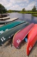 In areas along the banks of the Mersey River in Kejimkujik National Park in Nova Scotia, Canada, there are canoes available to use but rental fees are required.