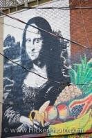 A wall mural on the exterior of a building at the Kensington Market in Toronto, Ontario displays a portrait of Mona Lisa.