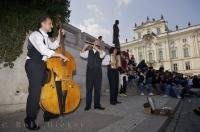 The entrance to Prague Castle in the Czech Republic can become very busy before opening and this musical group keeps the visitors happy while waiting.