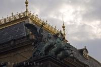 The facade of the National Theatre in downtown Prague is adorned with statues.