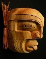 A Native American Indian art piece which is a beautifully carved mask of Pugwis on display at the Just Art Gallery in Port McNeill on Northern Vancouver Island.