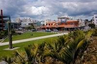 A pathway between the green park like setting leads to the main city streets of New Plymouth, Taranaki on the North Island of New Zealand.