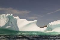 A large iceberg is beached along the coast in St Julien's on the Northern Peninsula of Newfoundland, Canada.