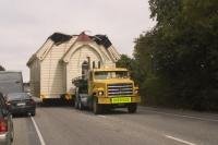 Stock photo of a Moving Company relocating a church building, a funny picture