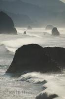 Beautiful coastal ocean scene during a big storm, bringing in large waves in to Cannon Beach in Oregon, USA.