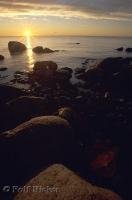 The rugged coastline of Gros Morne National Park during sunset in Newfoundland, Canada.