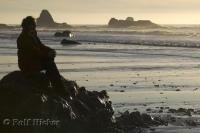 Watching the sun set at Ruby Beach on the Olympic Peninsula during a holiday in Washington, USA.