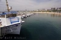 The pristine waters of the Mediterranean Sea gently lap the shores at Palamos in the region of Catalonia, Spain.