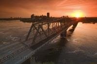A beautiful spring sunset looking across the Ottawa River and the Pont Alexandra Bridge from Nepean Point to Hull in Quebec, Canada.