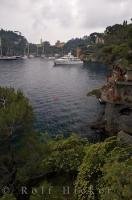 Luxury yachts line the harbour of Portofino on the Italian Riviera in Liguria, Italy.