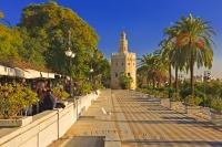 Along the promenade leading towards the Tower del Oro are many restaurants and street cafe's, mixed with locals and tourists, Seville, Spain.